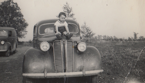 picture of Charles as a baby on the farm